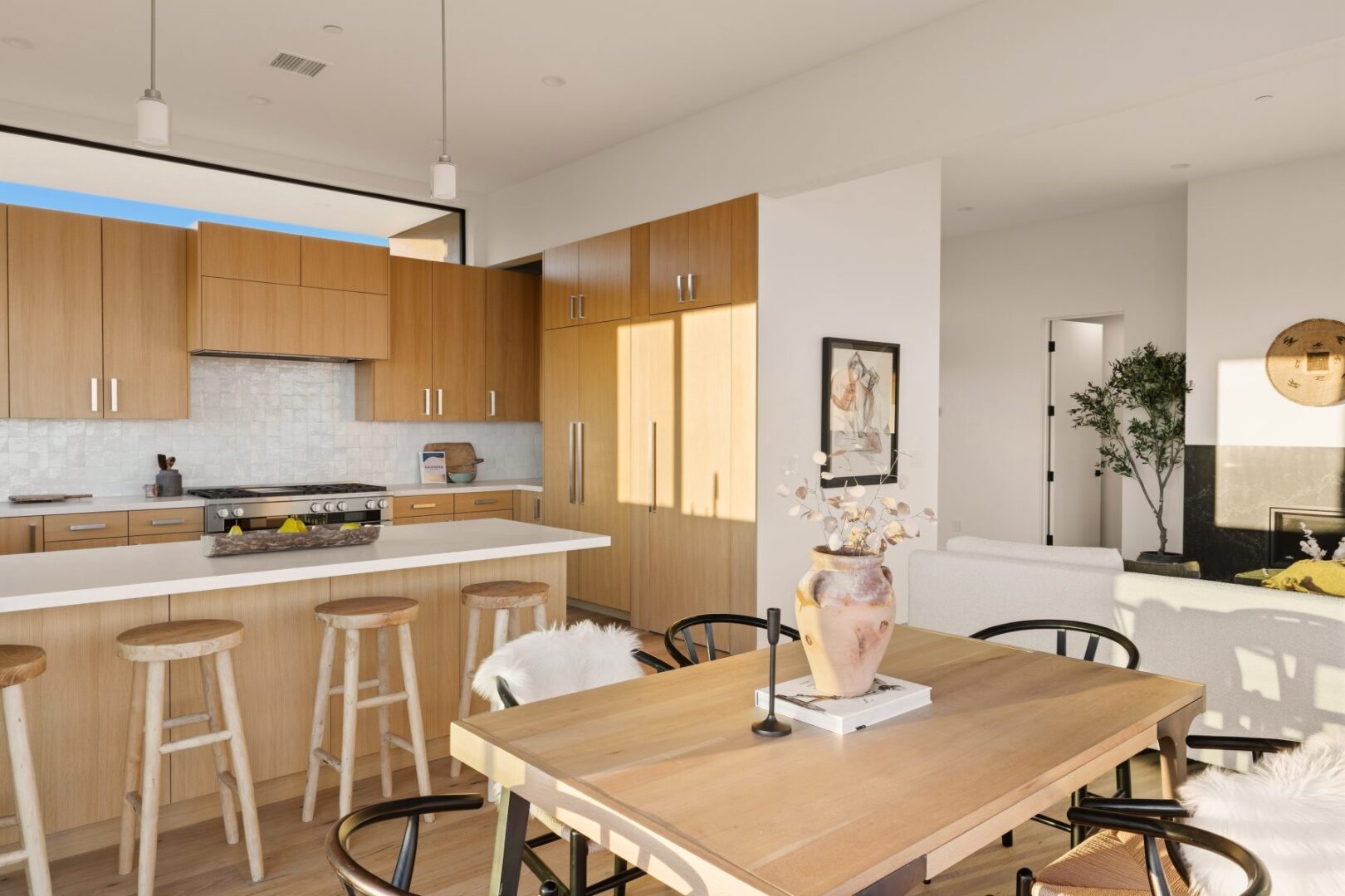 Another angle of the dining area showcasing the kitchen and decor.