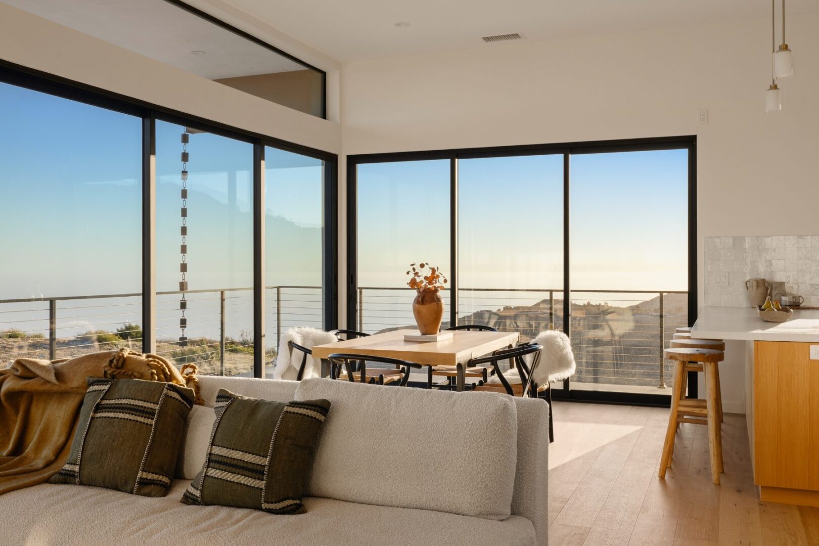 Dining area with large windows and a view of the outdoors.
