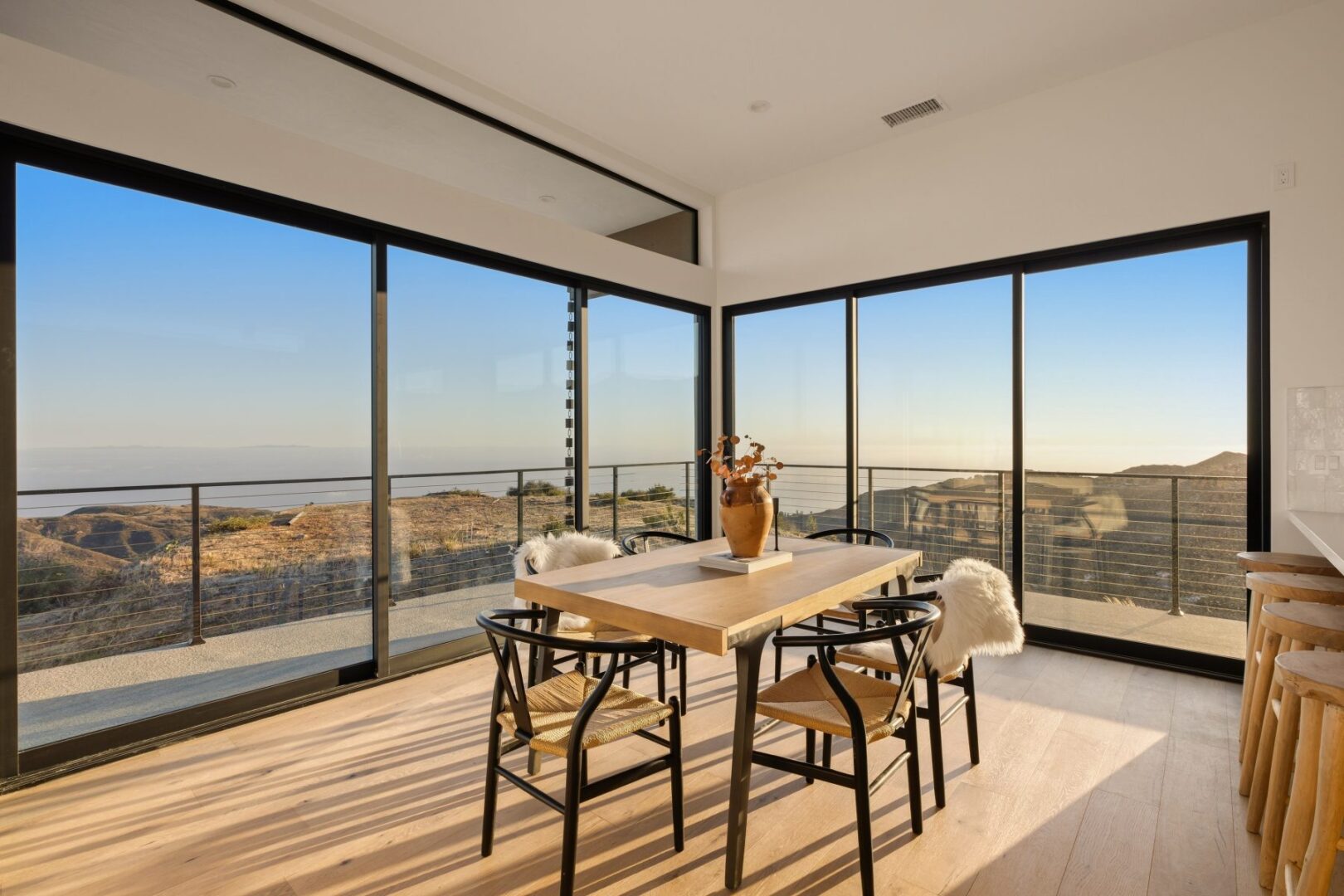 Dining table with a view and stylish decor elements.