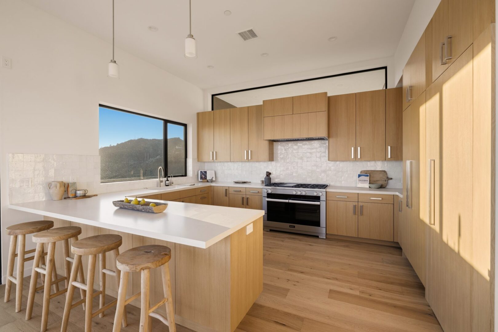 Another angle of the modern kitchen showcasing the layout and natural light.