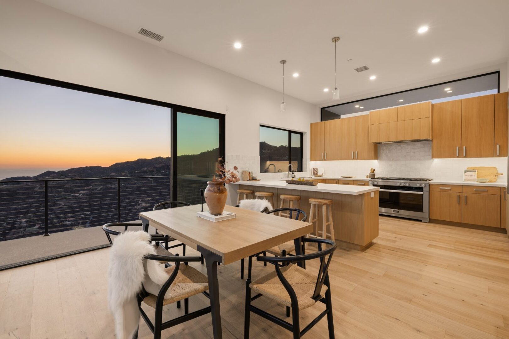 Kitchen with dining area, featuring modern appliances and a view of the ocean.